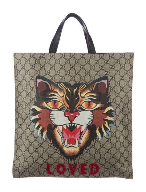 gucci cat cap|Gucci tote with cat.